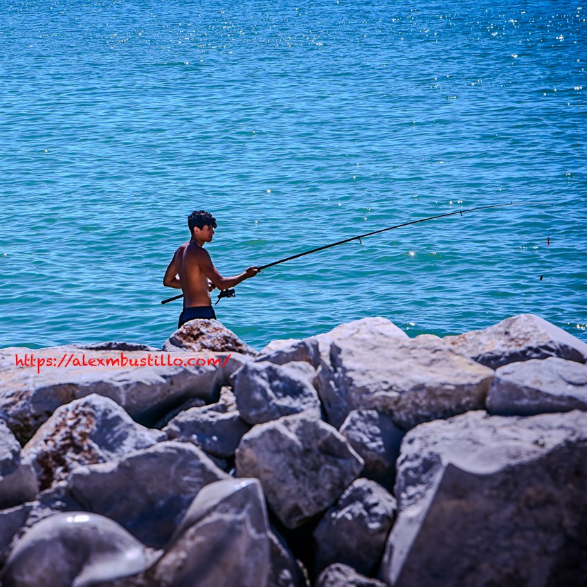 Shore Rock Fishing In Caorle, Veneto, Italy